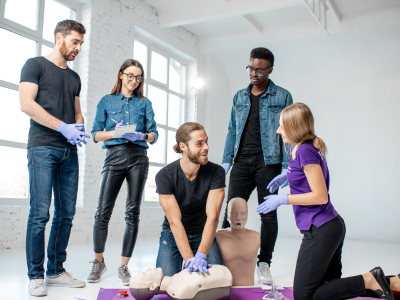 Healthcare professionals practicing ACLS skills in a simulated disaster response scenario.